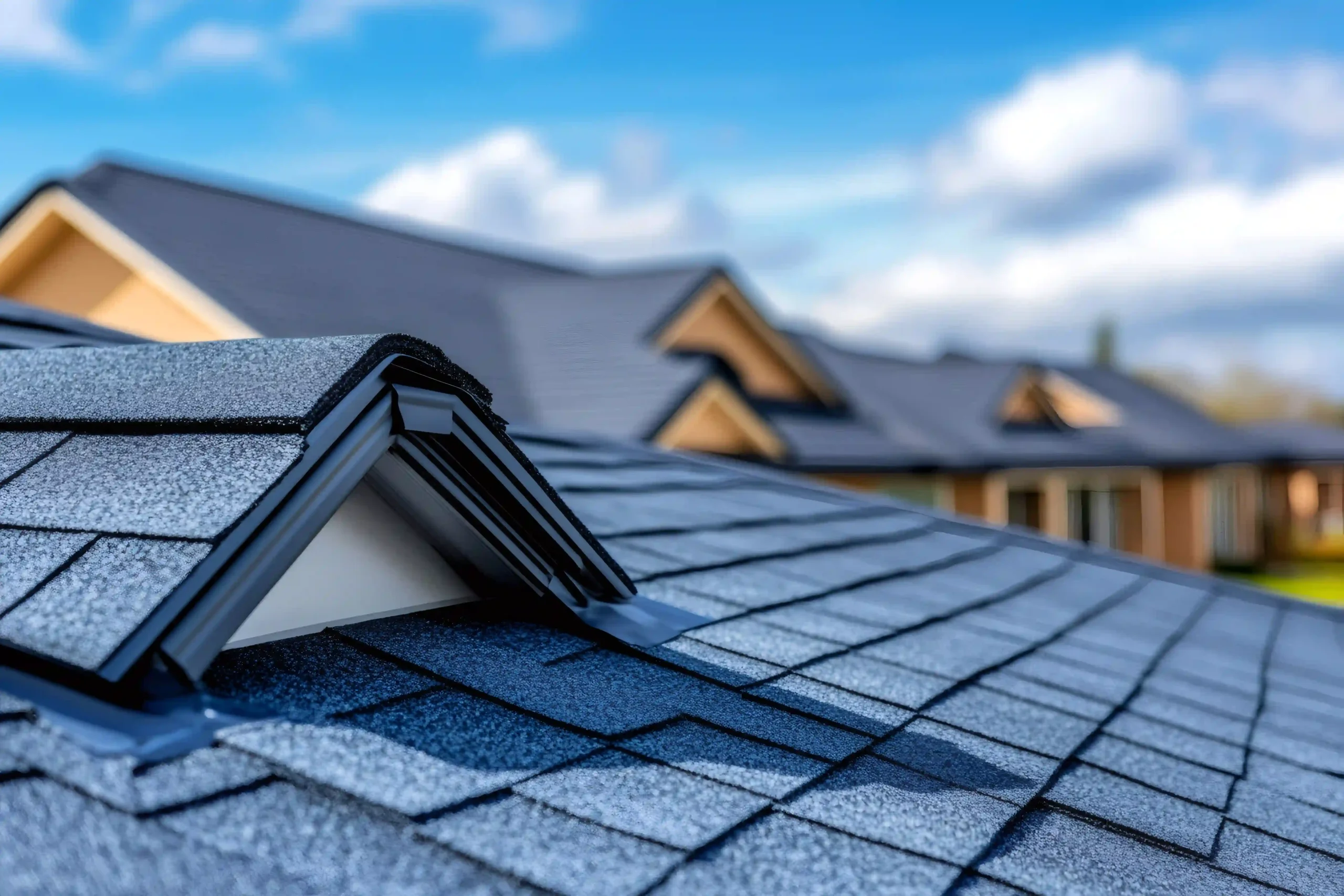 close up of asphalt shingles roofing with skylight on residential building photo